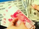Screenshot_20261023-100013_Gallery Nilai Tukar Rupiah Terhadap Dolar AS Hari Ini Jumat 23 Oktober 2026: Rupiah Melemah 0,21 Persen Ke Rp18.060, Proyeksi Rp18.020-Rp18.120. Penyebab: Minyak Brent US$112, Sentimen MSCI, BI Rate 5,75 Persen.